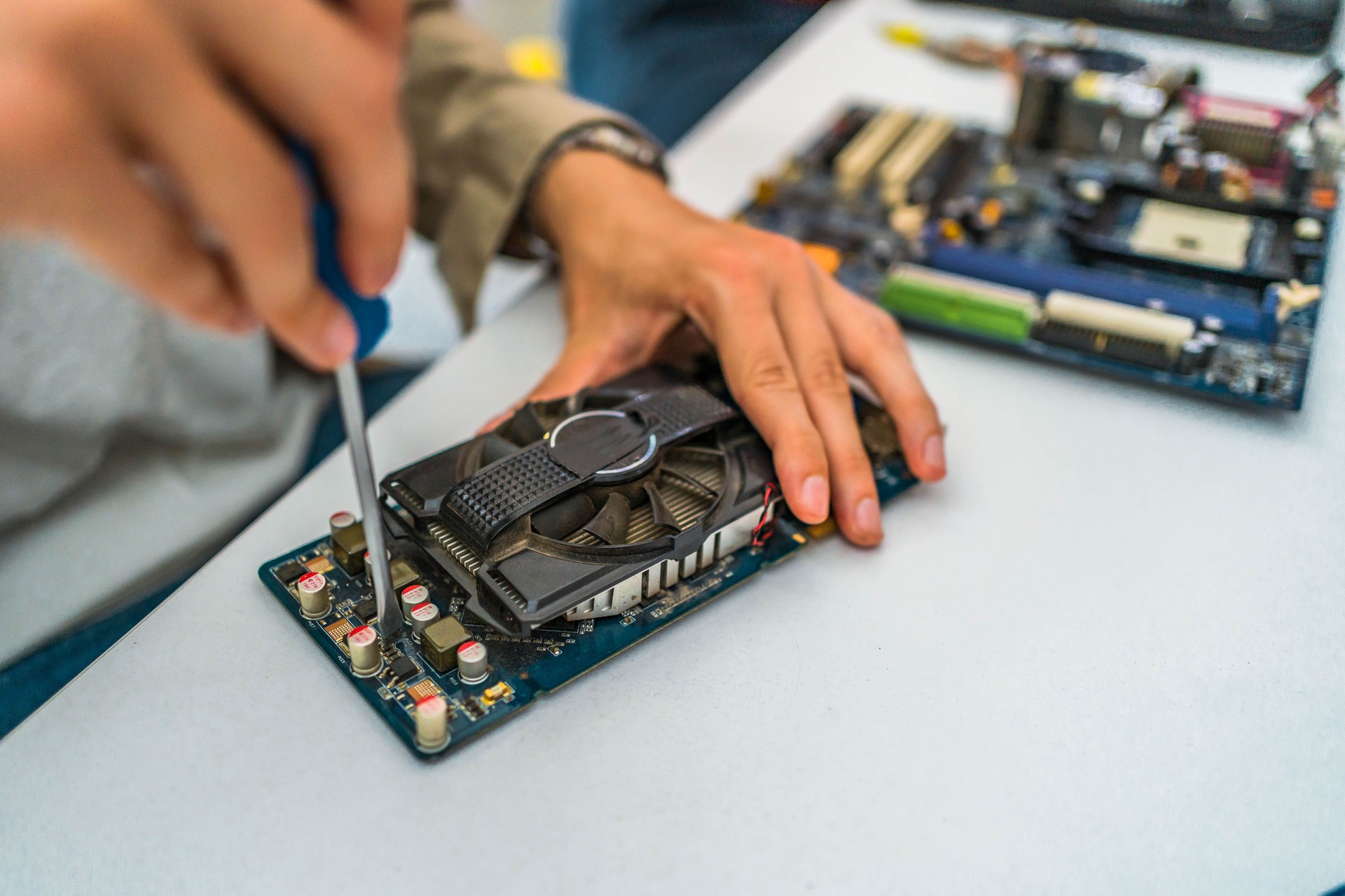 Technician repairing the graphics card