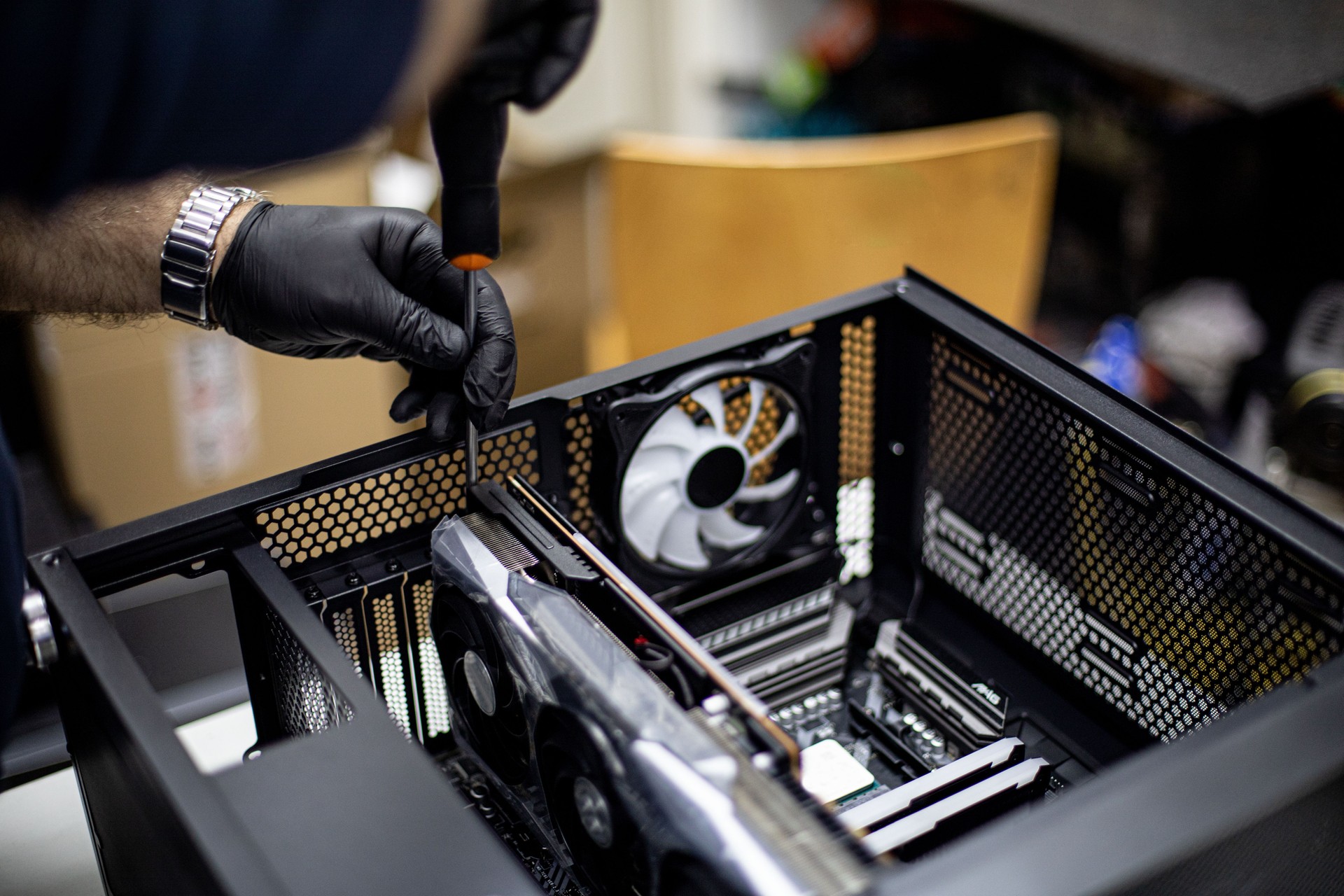 Professional man repairing and assembling a computer desktop