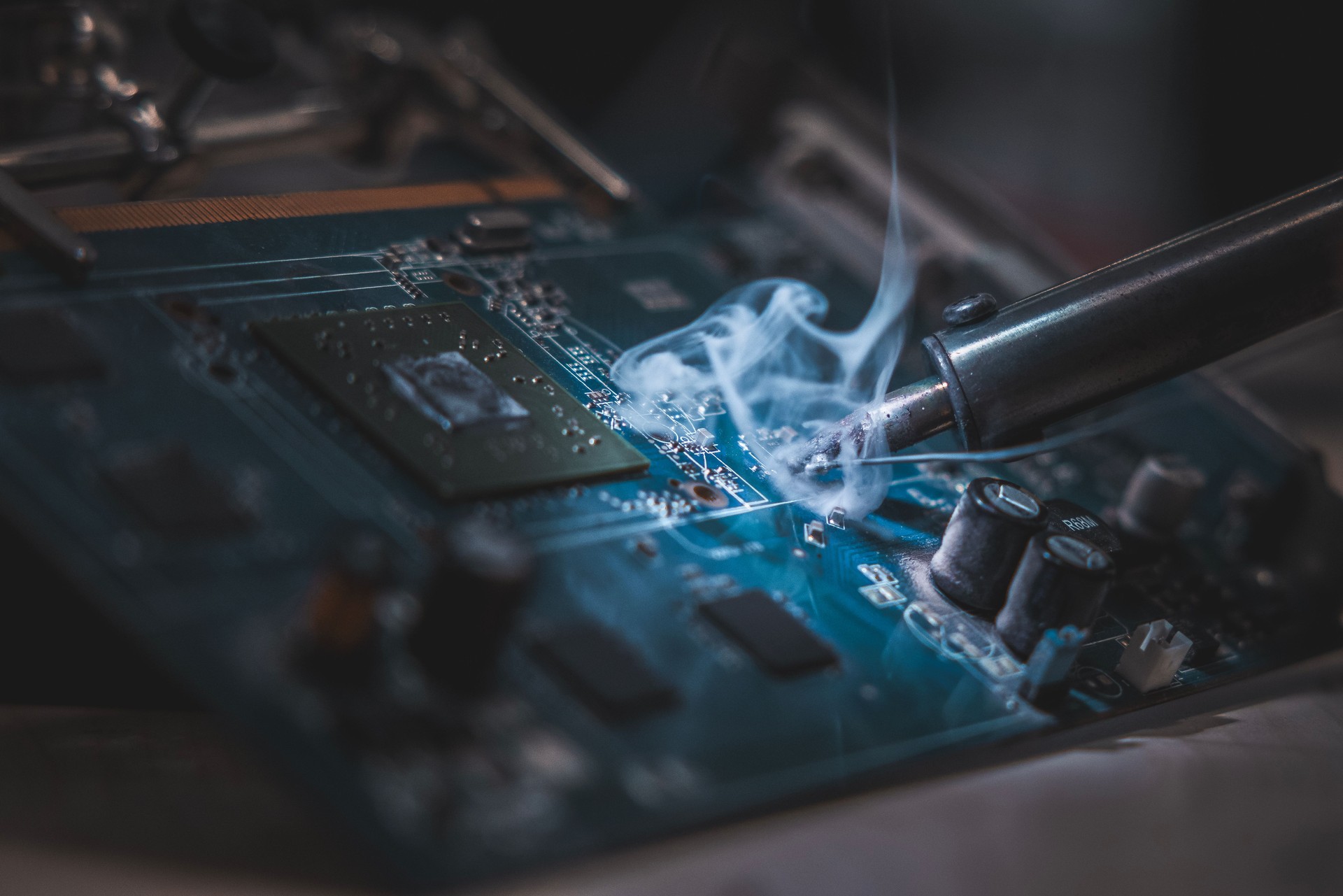 technician soldering a display card