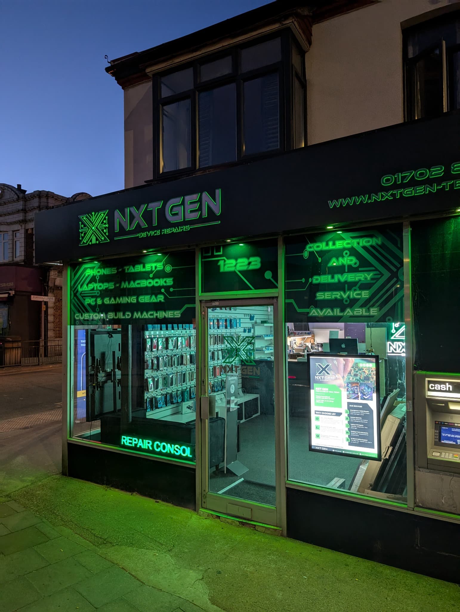 NXT GEN shopfront illuminated in green on London Road in Leigh-on-Sea.