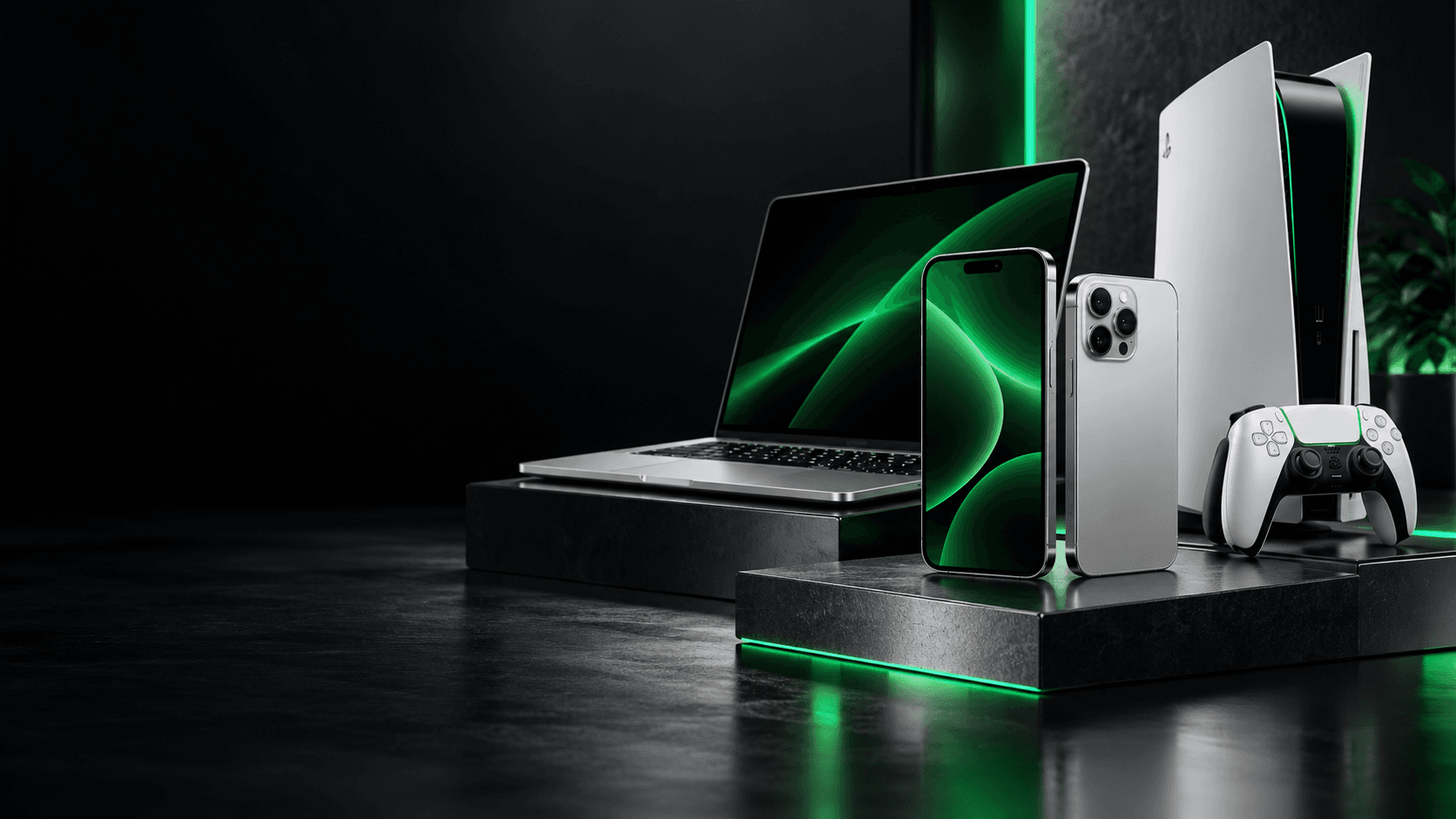 Phones, laptop and games console in a dark green-lit setting